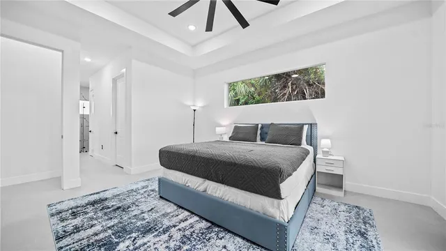 a view of a livingroom with workspace and a window