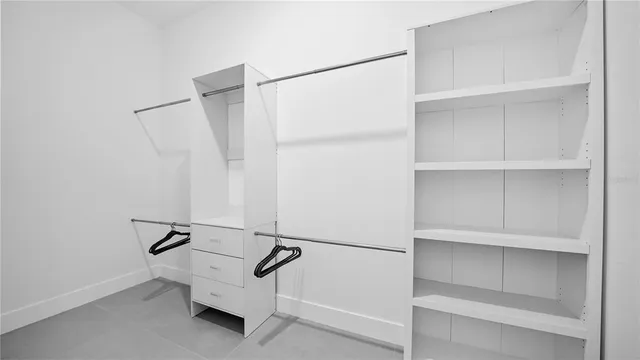 a bathroom with a granite countertop sink mirror and toilet