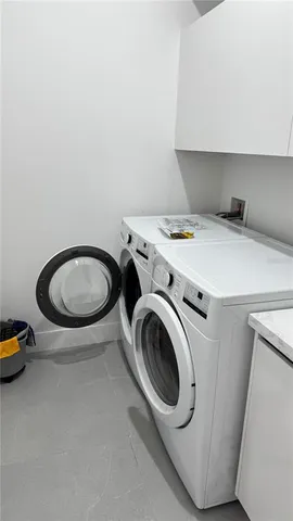 a car parked in front of a house with a yard