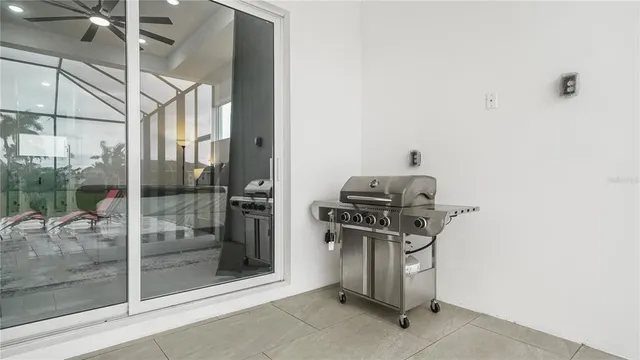 a view of an empty room with gym equipment