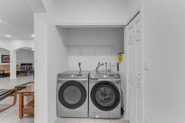 a bathroom with a bathtub shower sink vanity and toilet