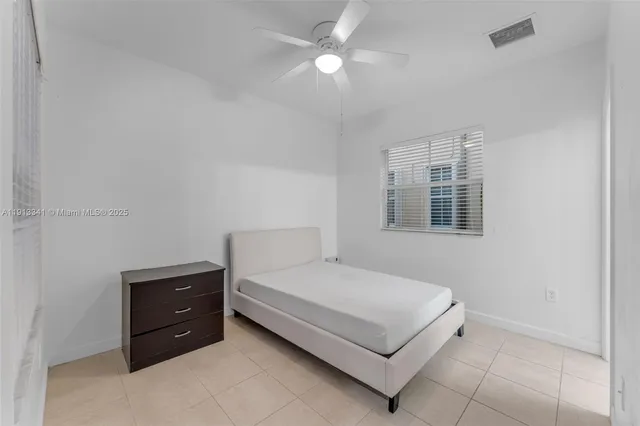 a bathroom with a sink toilet vanity and shower