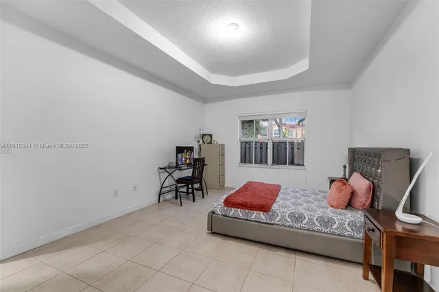 a white toilet next to a bathroom