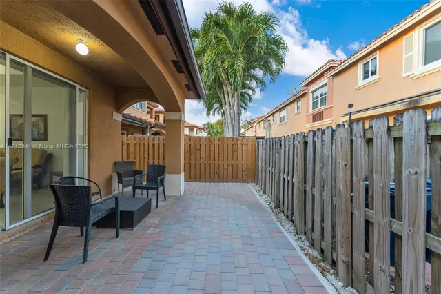 a view of swimming pool with outdoor seating