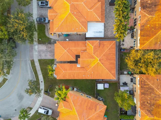 an aerial view of residential houses with outdoor space