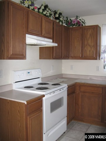 4044 Kings Row Reno, NV 89503 - Photo 3 of 3 a kitchen with a stove and a sink