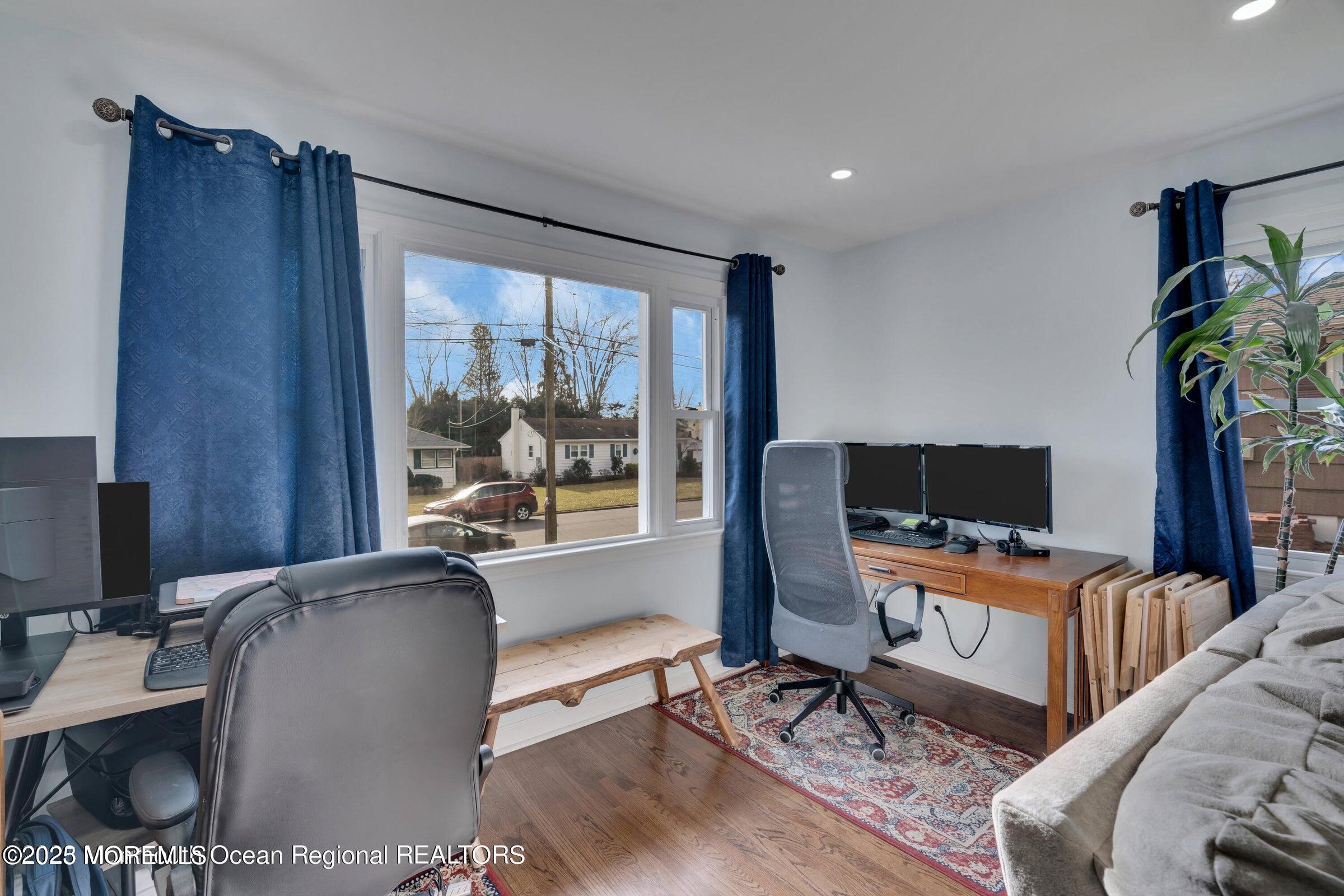 1114 Mohegan Road Manasquan, NJ 08736 - Photo 11 of 28 a bedroom with furniture and a window