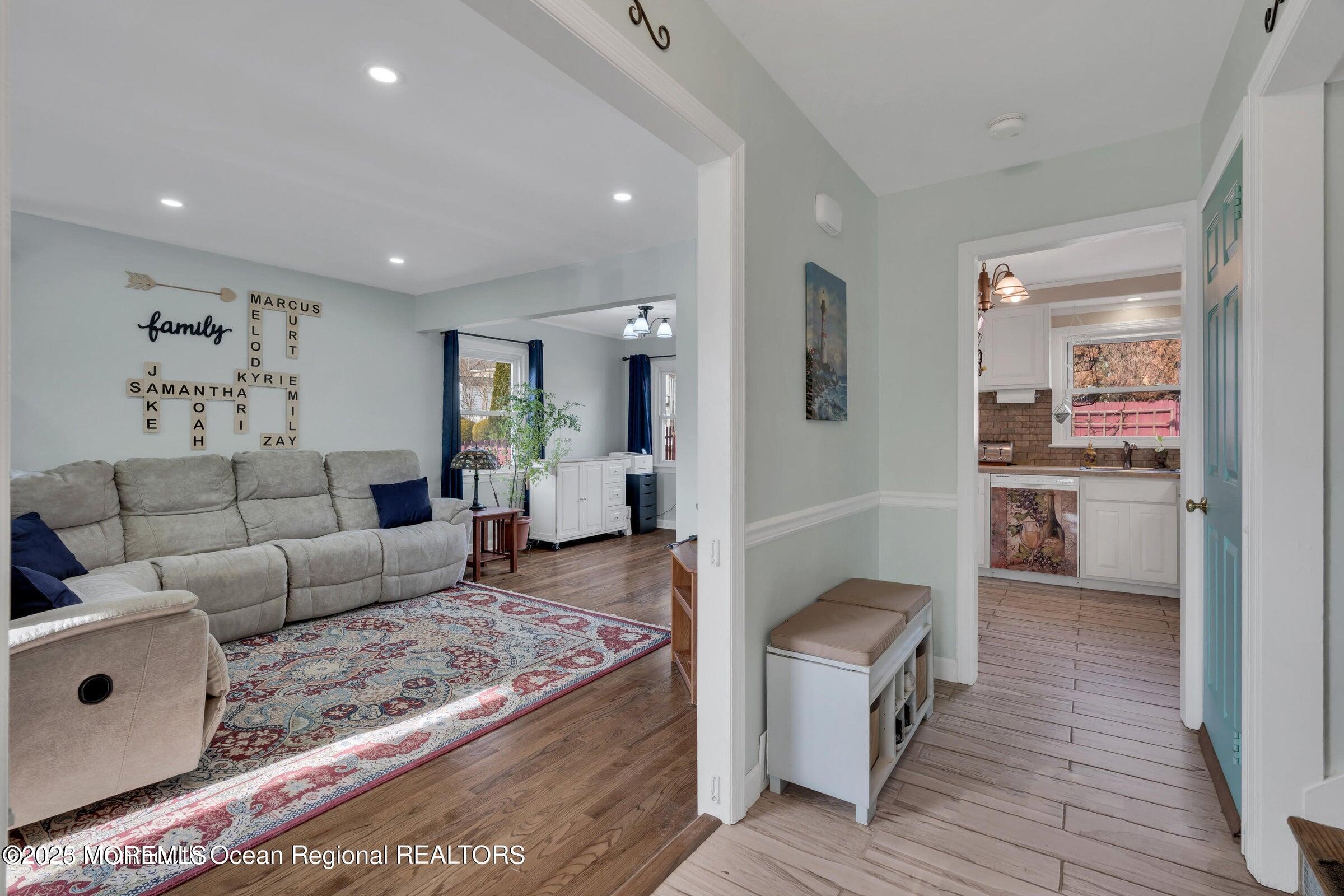 1114 Mohegan Road Manasquan, NJ 08736 - Photo 13 of 28 a living room with furniture and a wooden floor
