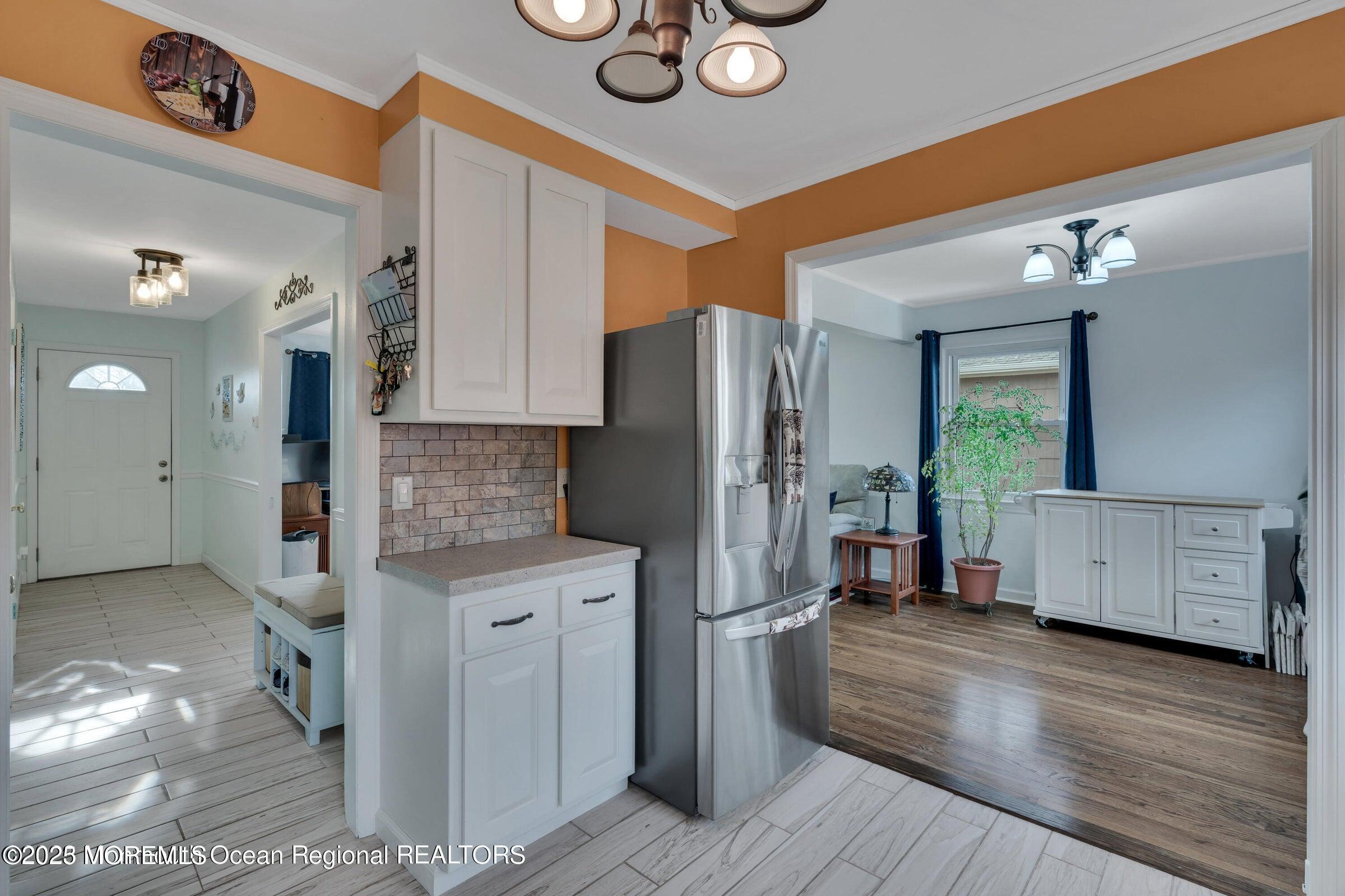 1114 Mohegan Road Manasquan, NJ 08736 - Photo 19 of 28 a kitchen with stainless steel appliances granite countertop a refrigerator and a stove
