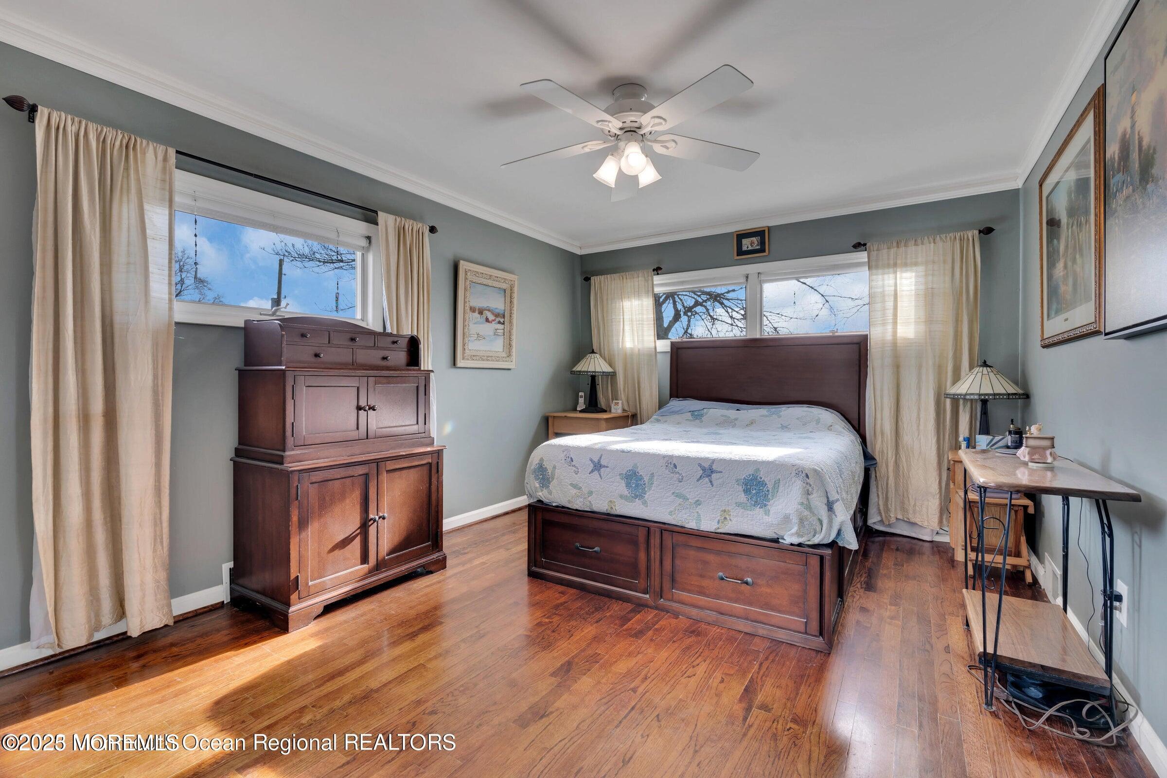1114 Mohegan Road Manasquan, NJ 08736 - Photo 24 of 28 a bedroom with a bed furniture and a window