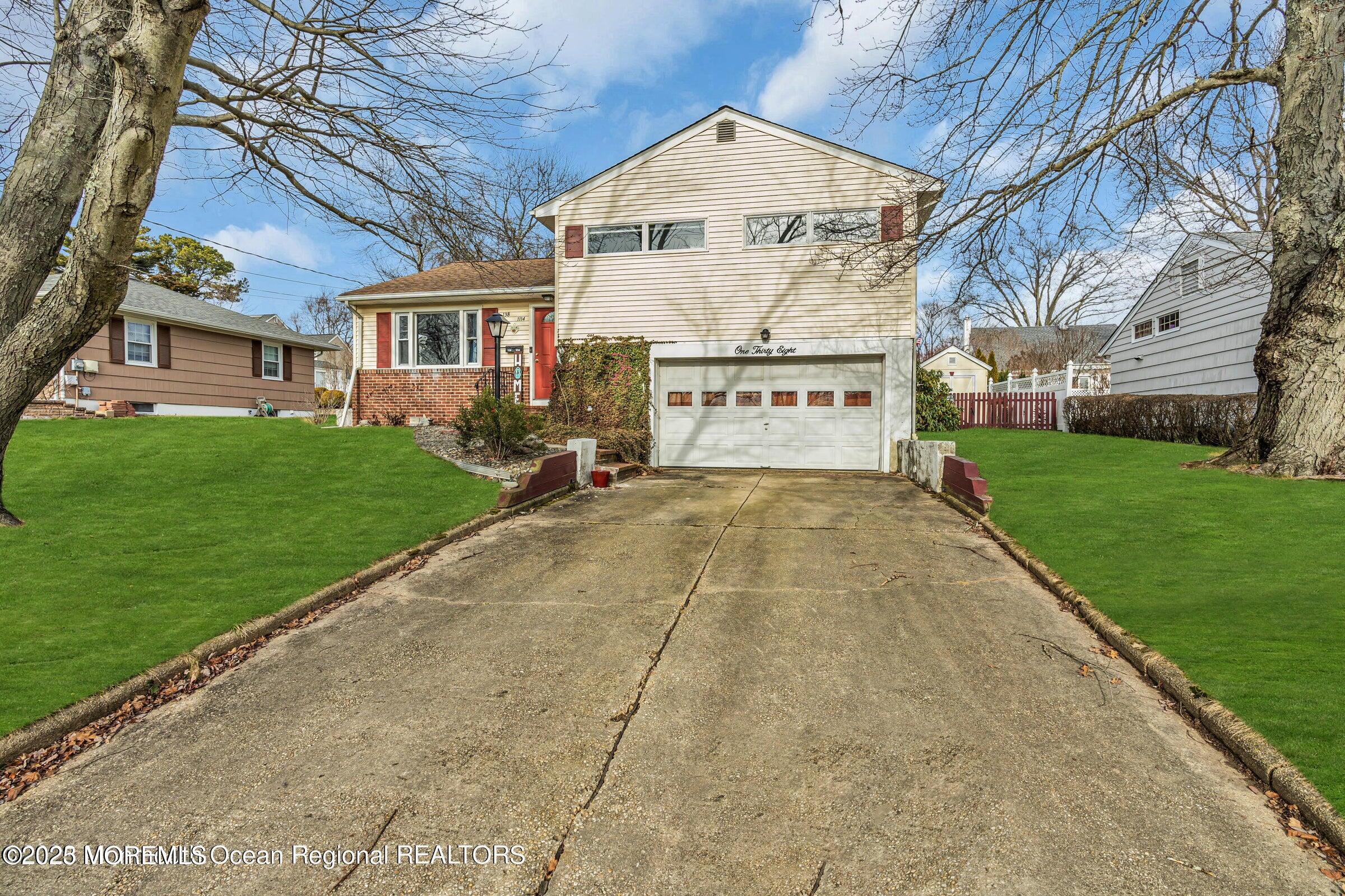 1114 Mohegan Road Manasquan, NJ 08736 - Photo 3 of 28 a view of a building with a street