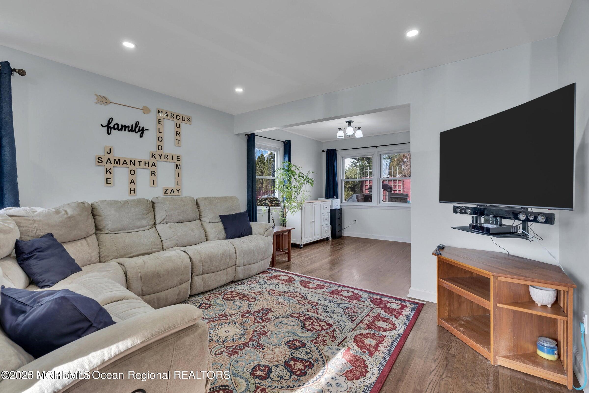 1114 Mohegan Road Manasquan, NJ 08736 - Photo 10 of 28 a living room with furniture and a flat screen tv