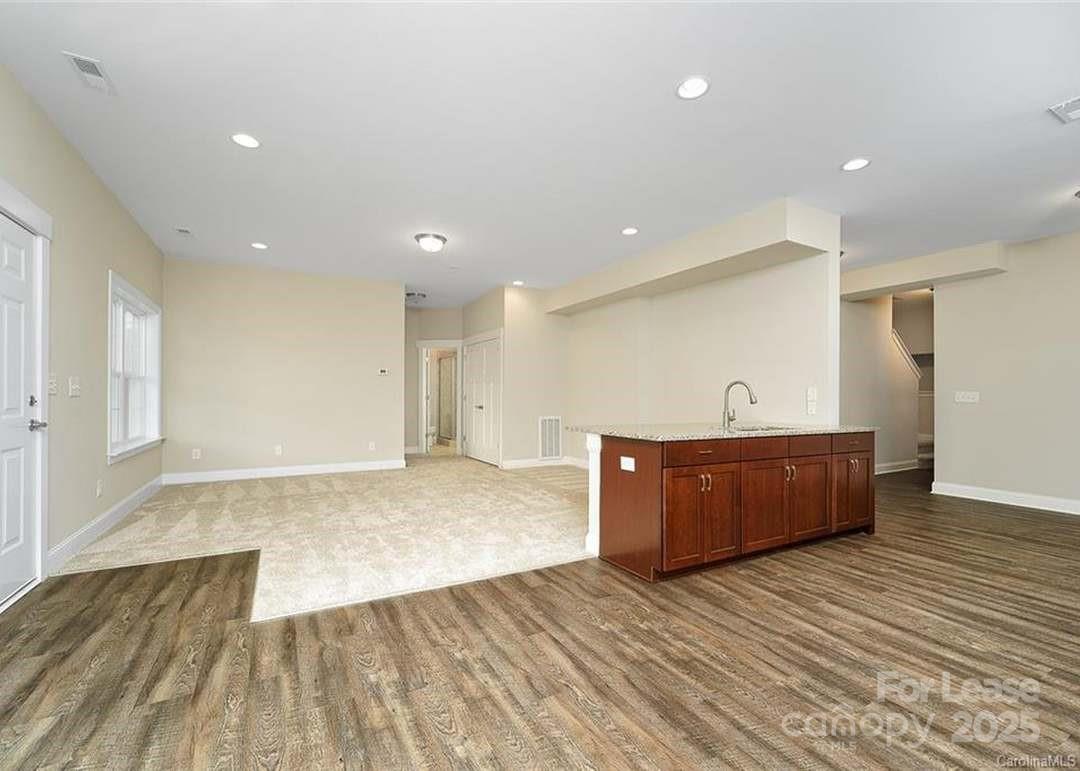 13012 Vermillion Crossing Court Huntersville, NC 28078 - Photo 15 of 18 a view of kitchen with wooden floor and window