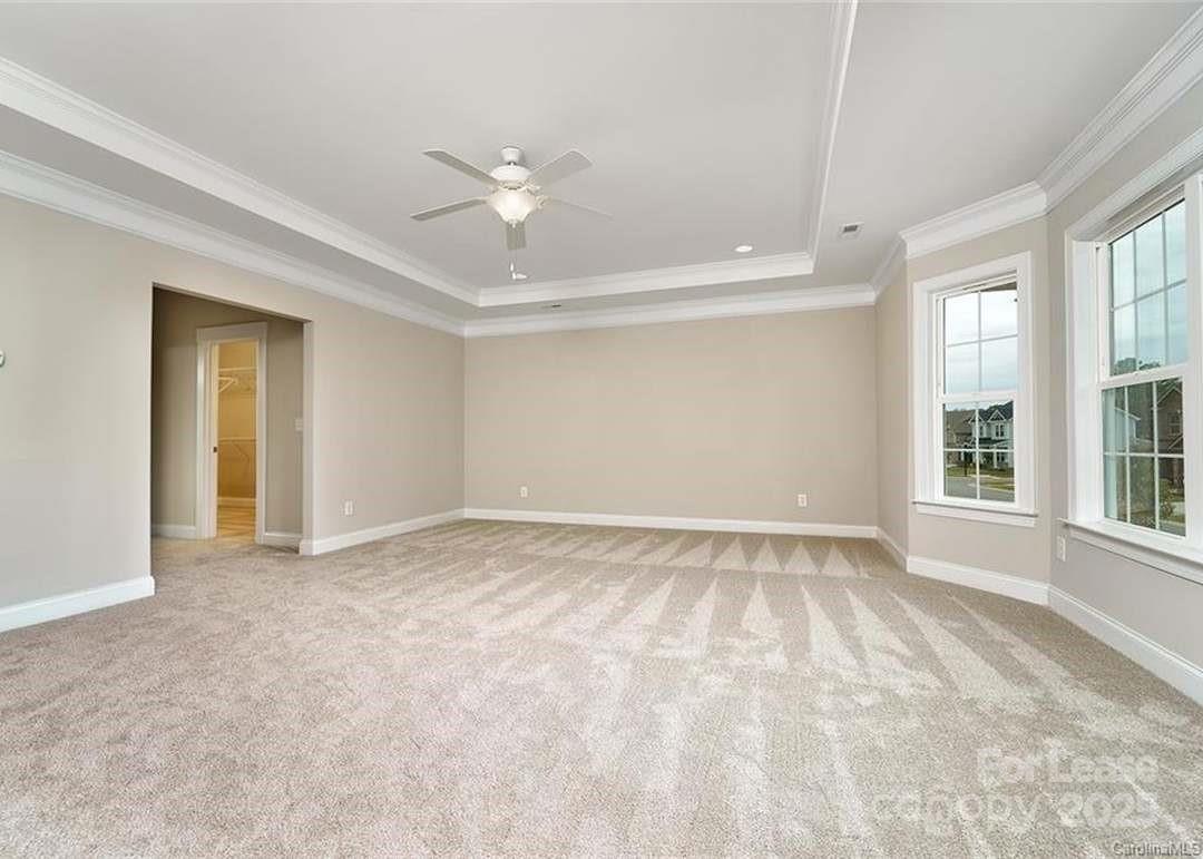 13012 Vermillion Crossing Court Huntersville, NC 28078 - Photo 9 of 18 a view of an empty room with a window