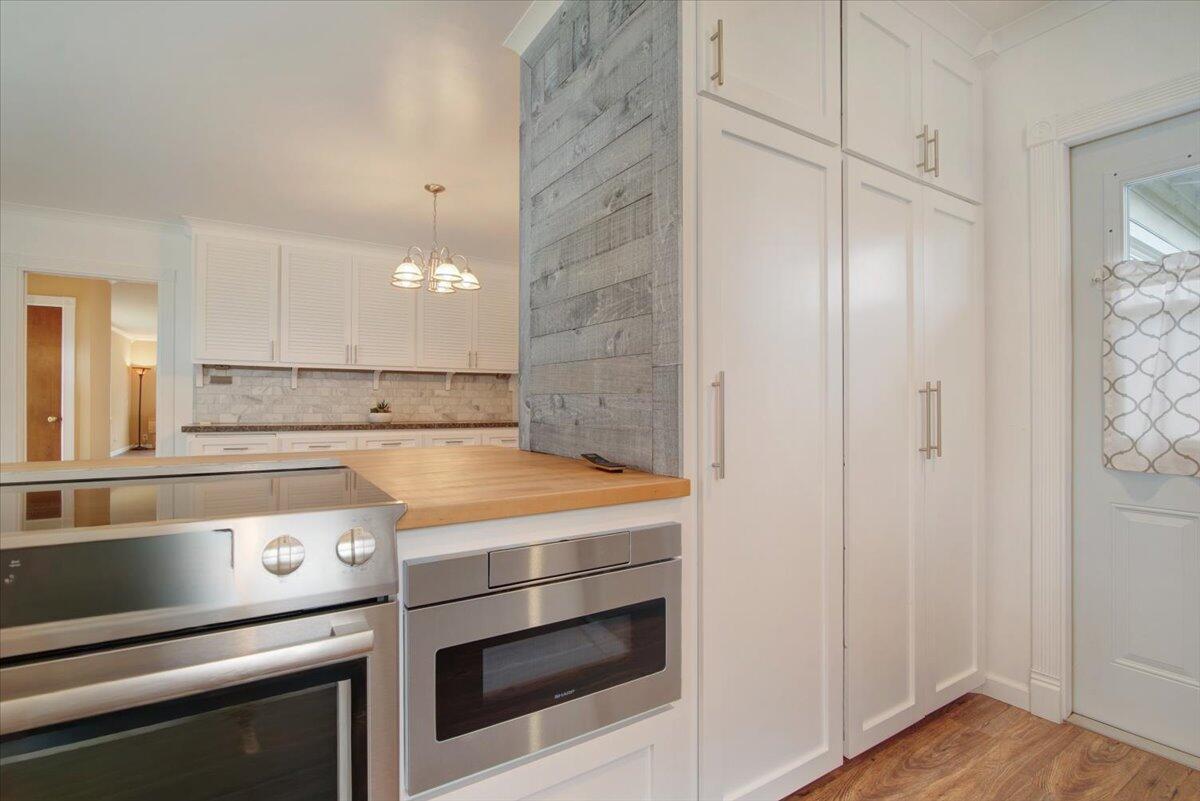 403 South M Street Lompoc, CA 93436 - Photo 13 of 32 a stove top oven sitting inside of a kitchen