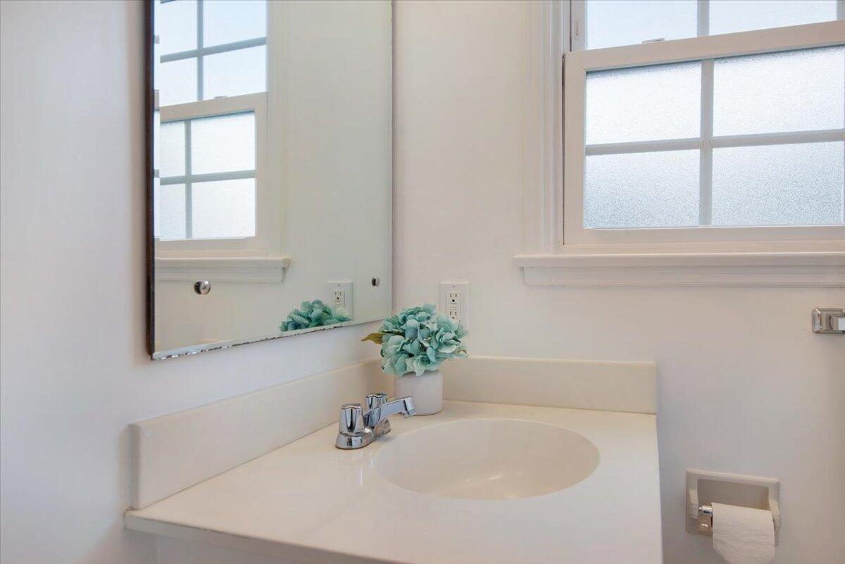 403 South M Street Lompoc, CA 93436 - Photo 22 of 32 a bathroom with a sink and a window