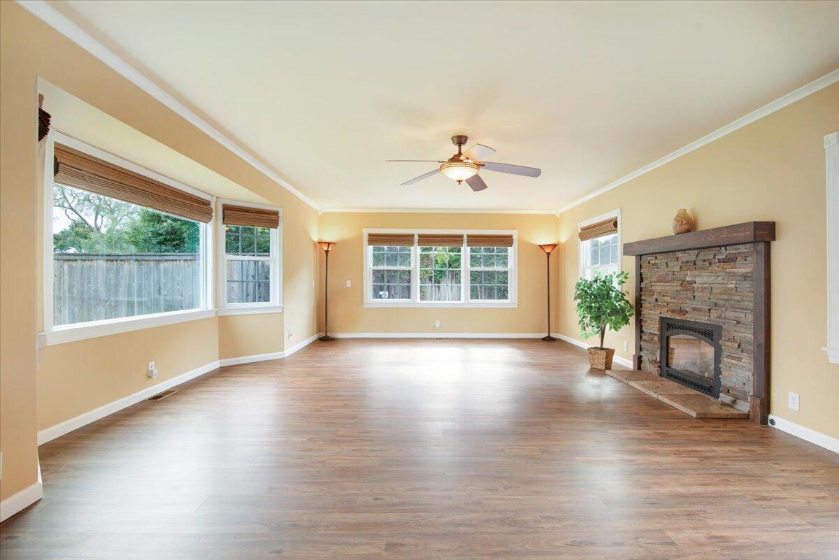403 South M Street Lompoc, CA 93436 - Photo 3 of 32 a view of an empty room with wooden floor and a window
