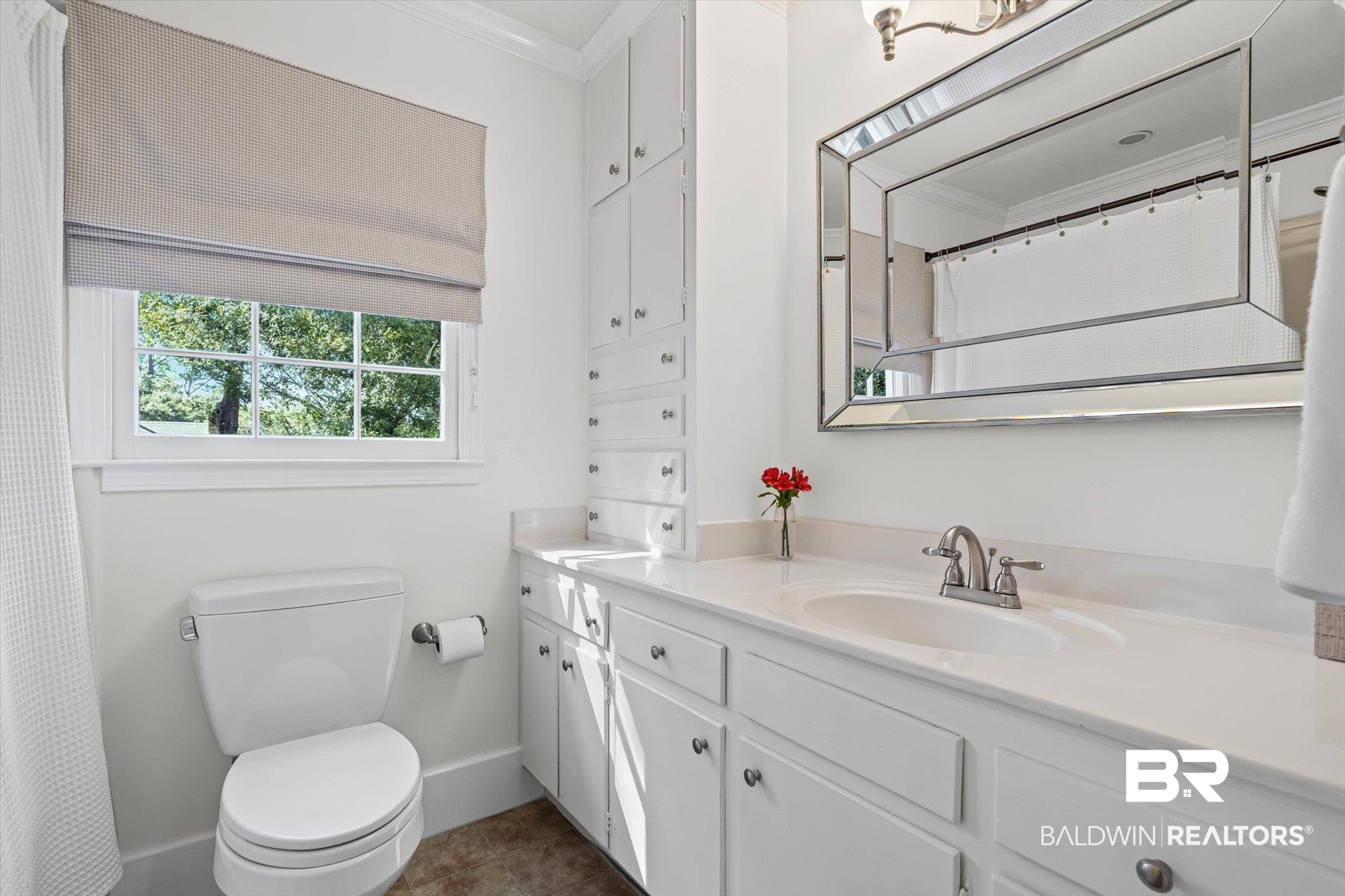 513 Spring Park Drive East Mobile, AL 36608 - Photo 29 of 44 Bathroom featuring vanity, ornamental molding, dark tile patterned floors, and a shower with shower curtain