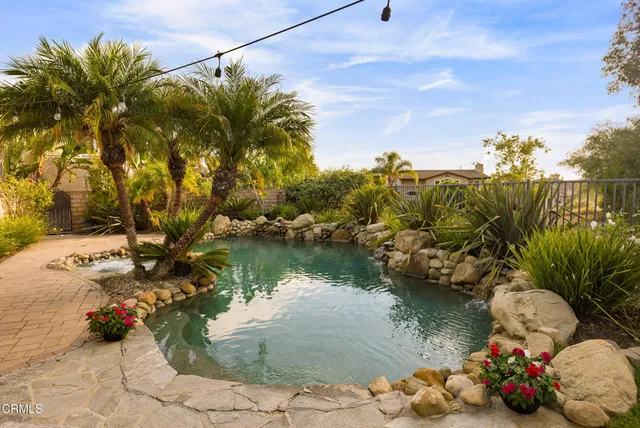 a view of a chairs and table in the patio