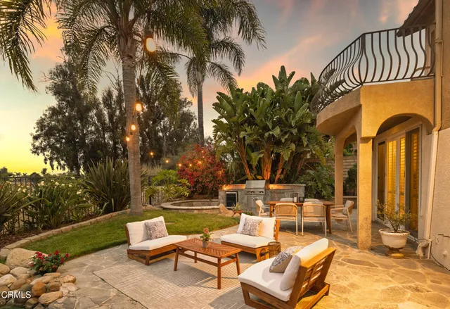 a view of a lake with couches and city view