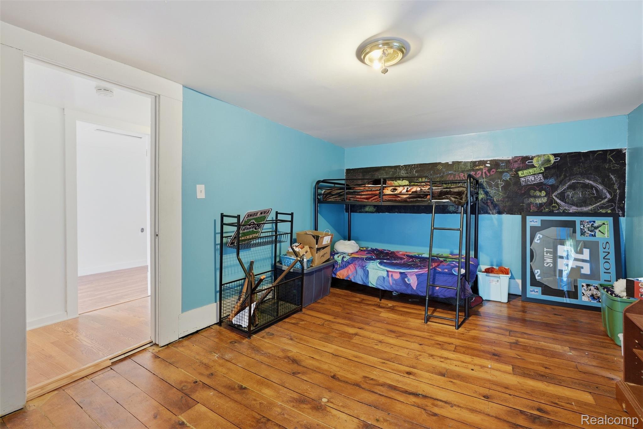 8732 Kinch Road Jackson, MI 49201 - Photo 26 of 39 Bedroom with wood-type flooring and baseboards
