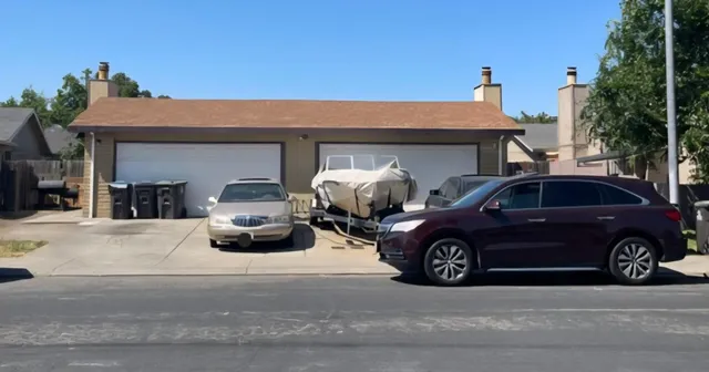 a car parked in front of a house