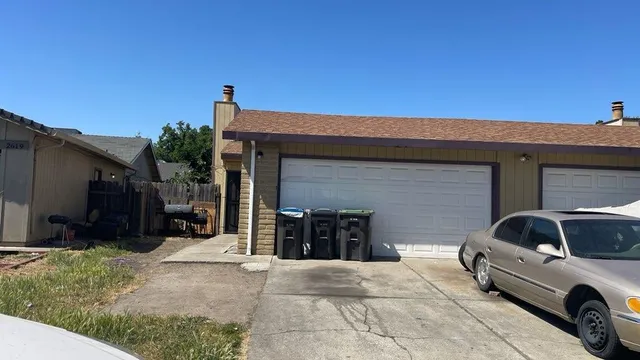 a view of a car parked in front of a building
