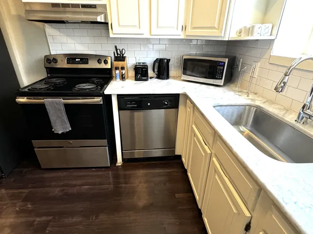 a kitchen with a stove and a sink