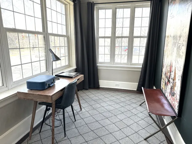a workspace with furniture and window