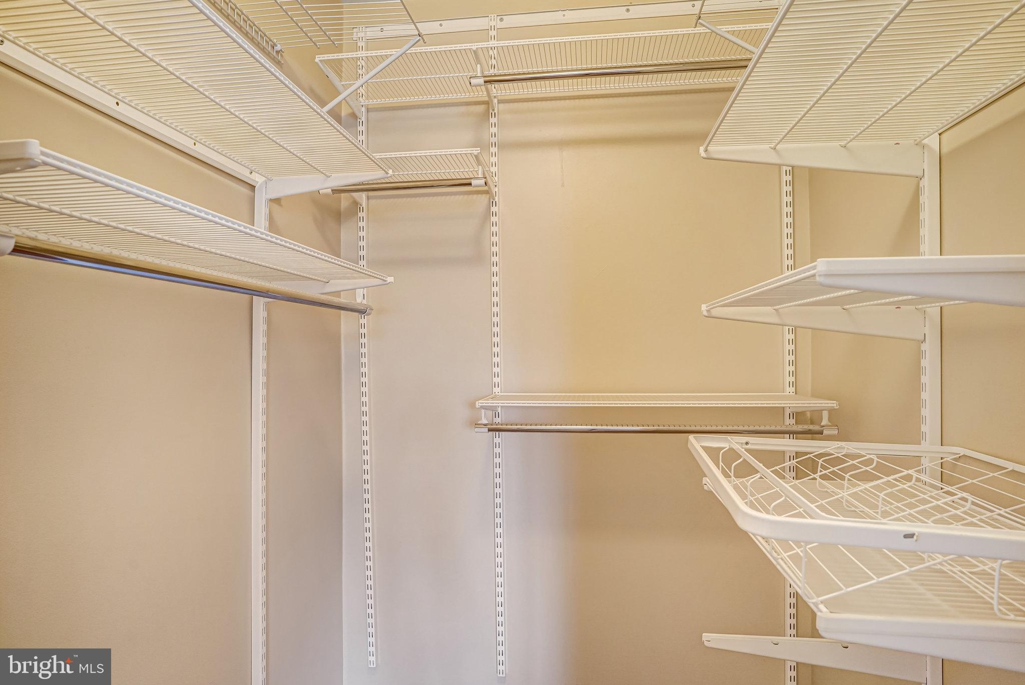 6143 Edsall Road, Unit J Alexandria, VA 22304 - Photo 11 of 23 a view of walk in closet with empty racks