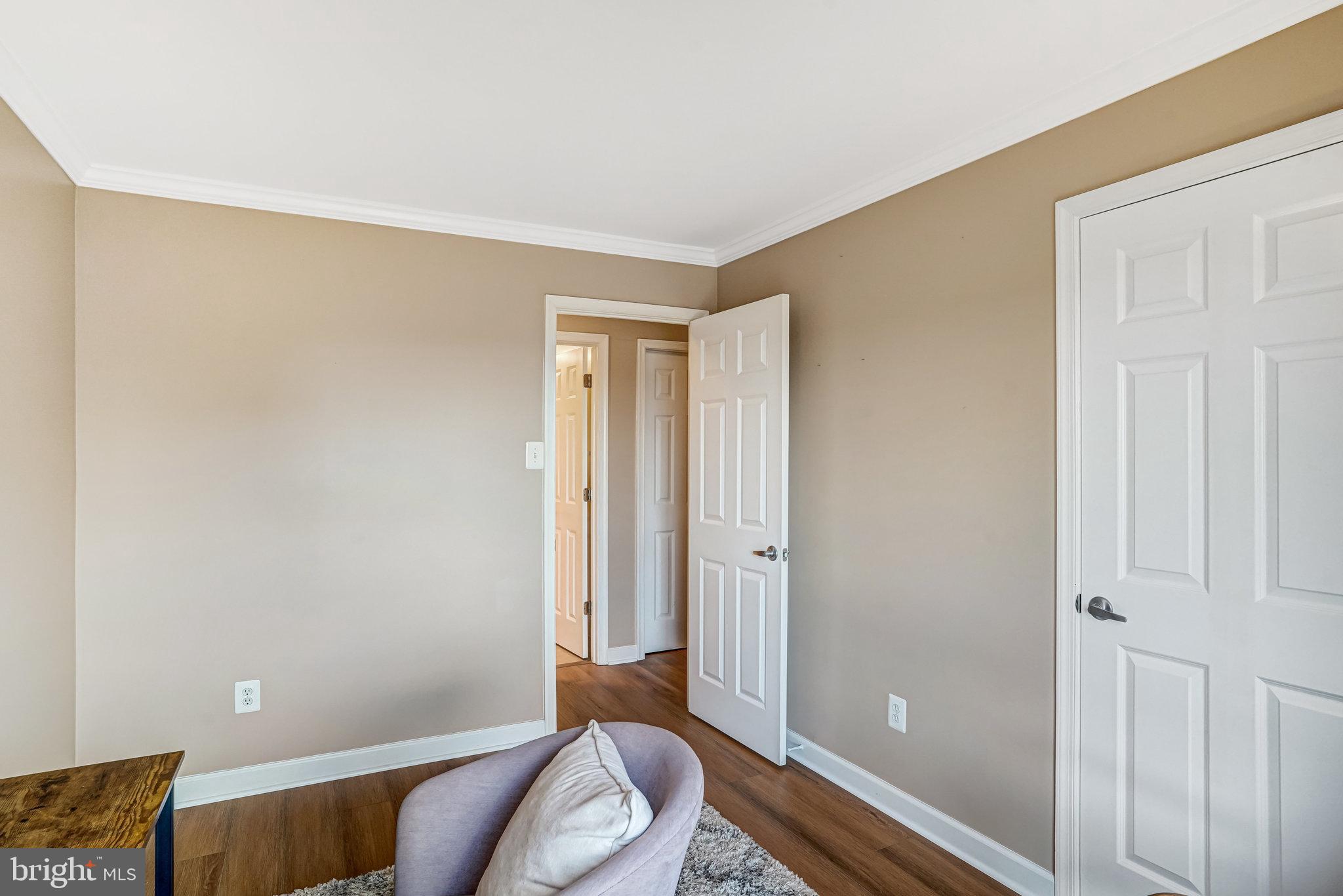6143 Edsall Road, Unit J Alexandria, VA 22304 - Photo 14 of 23 a living room with a bed and a window