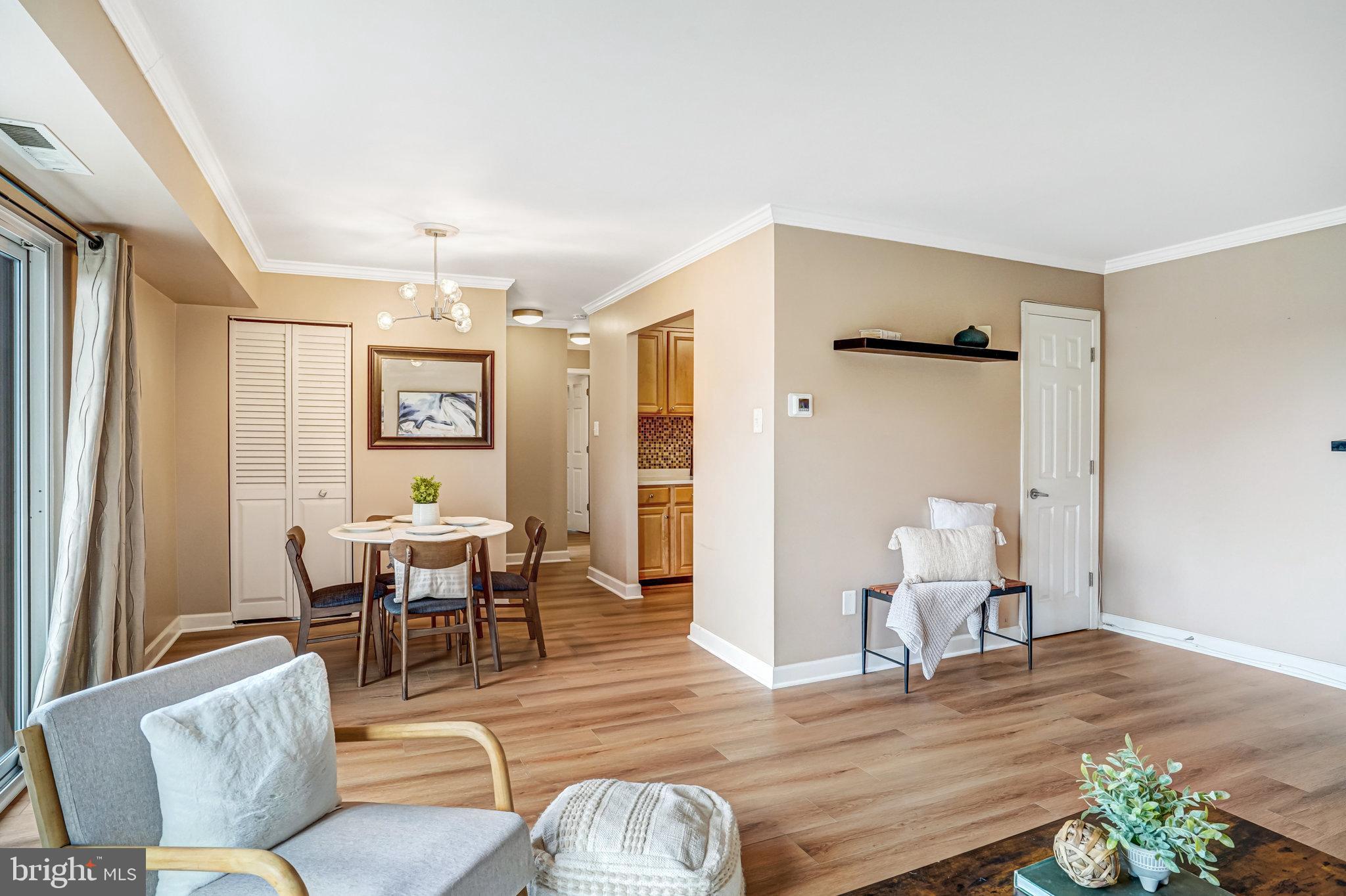 6143 Edsall Road, Unit J Alexandria, VA 22304 - Photo 23 of 23 a living room with furniture and wooden floor