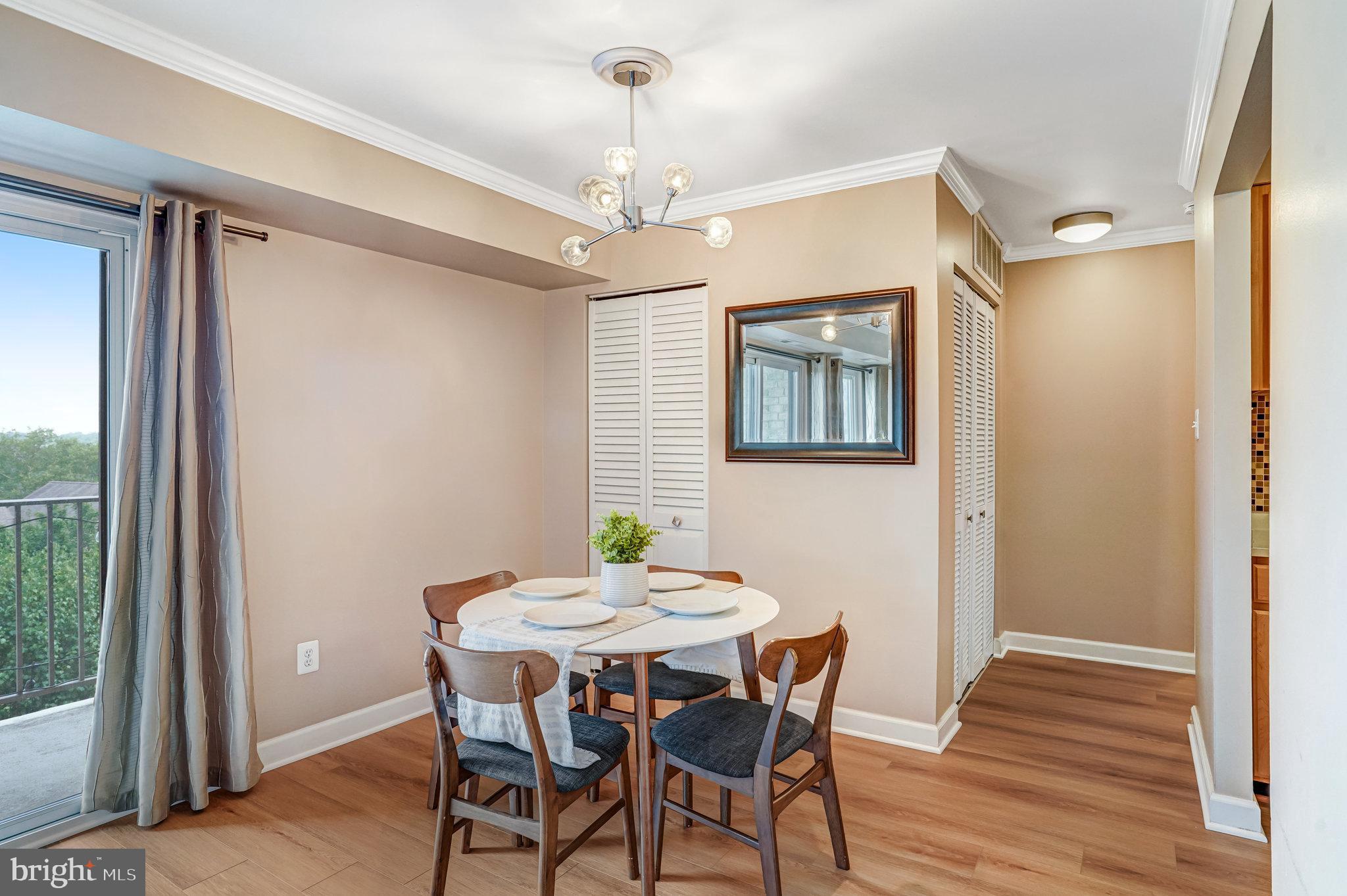6143 Edsall Road, Unit J Alexandria, VA 22304 - Photo 4 of 23 a view of a dining room with furniture window and wooden floor