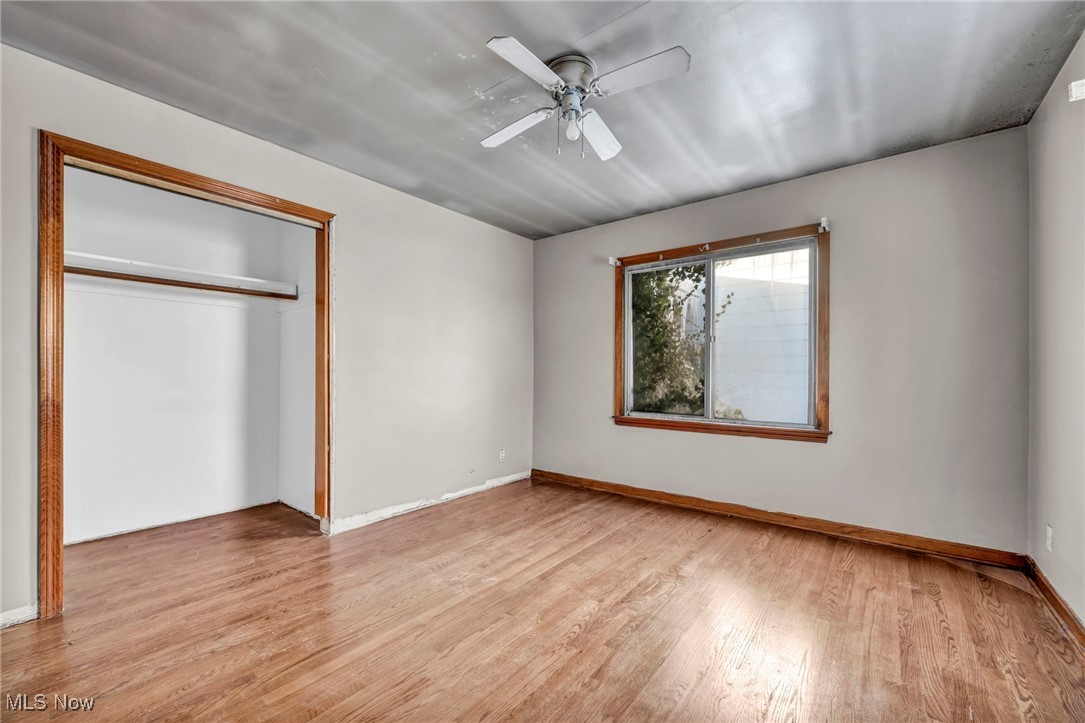 14750 Schreiber Road Maple Heights, OH 44137 - Photo 20 of 44 Unfurnished bedroom featuring light wood-style flooring, a closet, and ceiling fan