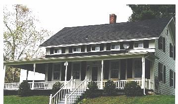 101 Main Road Tyringham, MA 01264 - Photo 1 of 1 a front view of a house with a yard