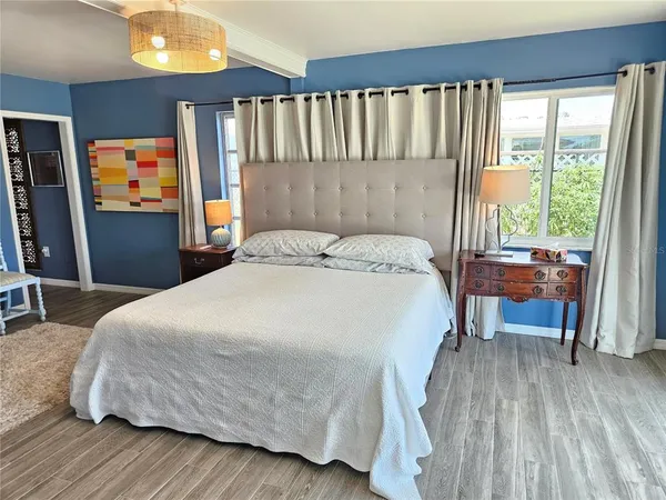 a bedroom with a bed and a table