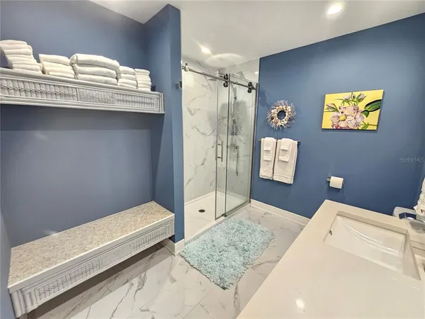 a bathroom with a tub and a sink