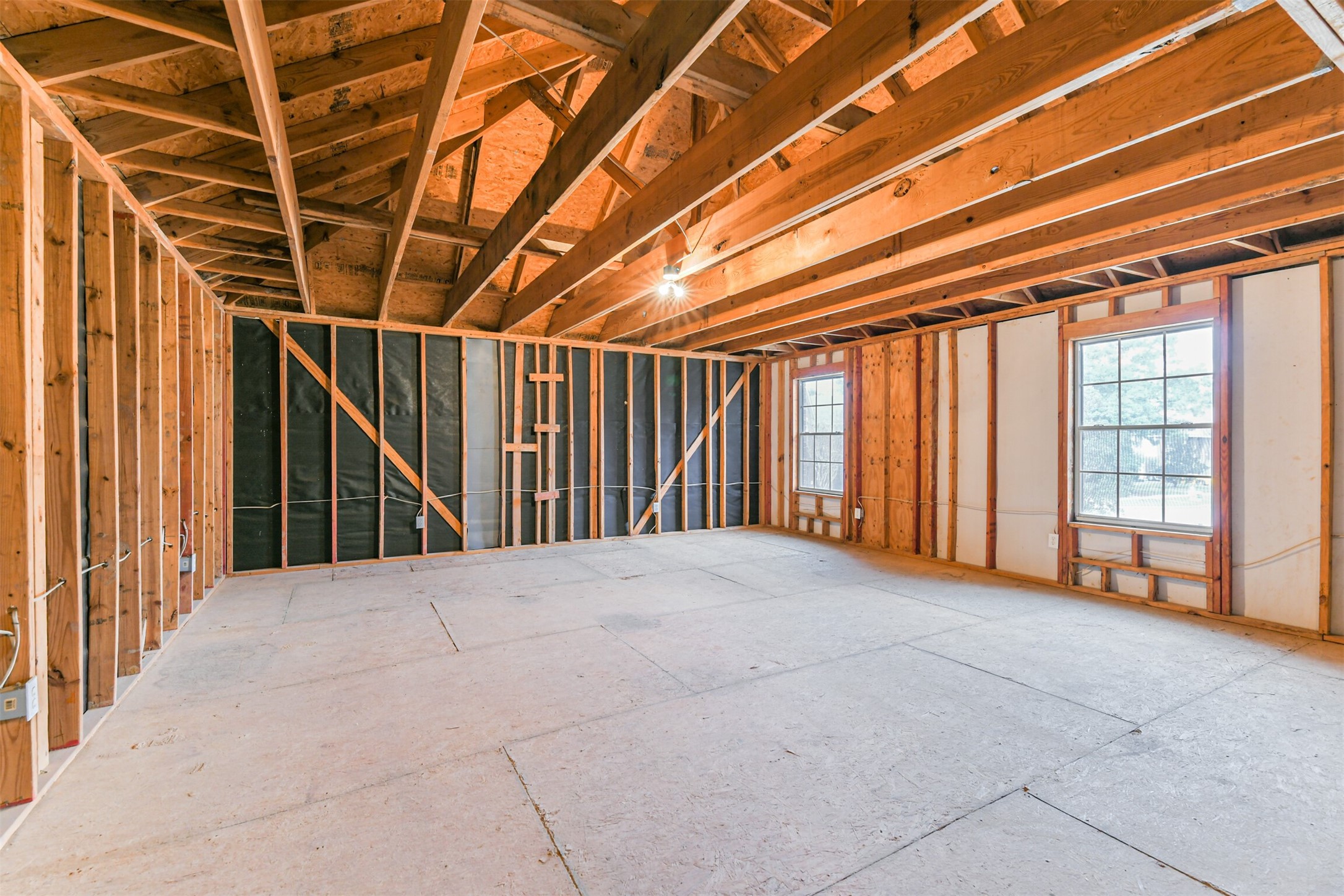 823 Hannock Glen Lane Spring, TX 77373 - Photo 11 of 48 a view of an empty room with wooden walls and a window