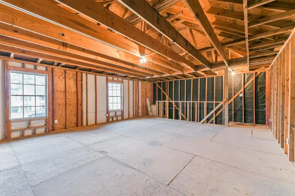a view of an empty room with windows