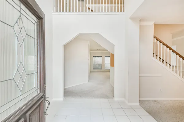 a view of an entryway with wooden floor