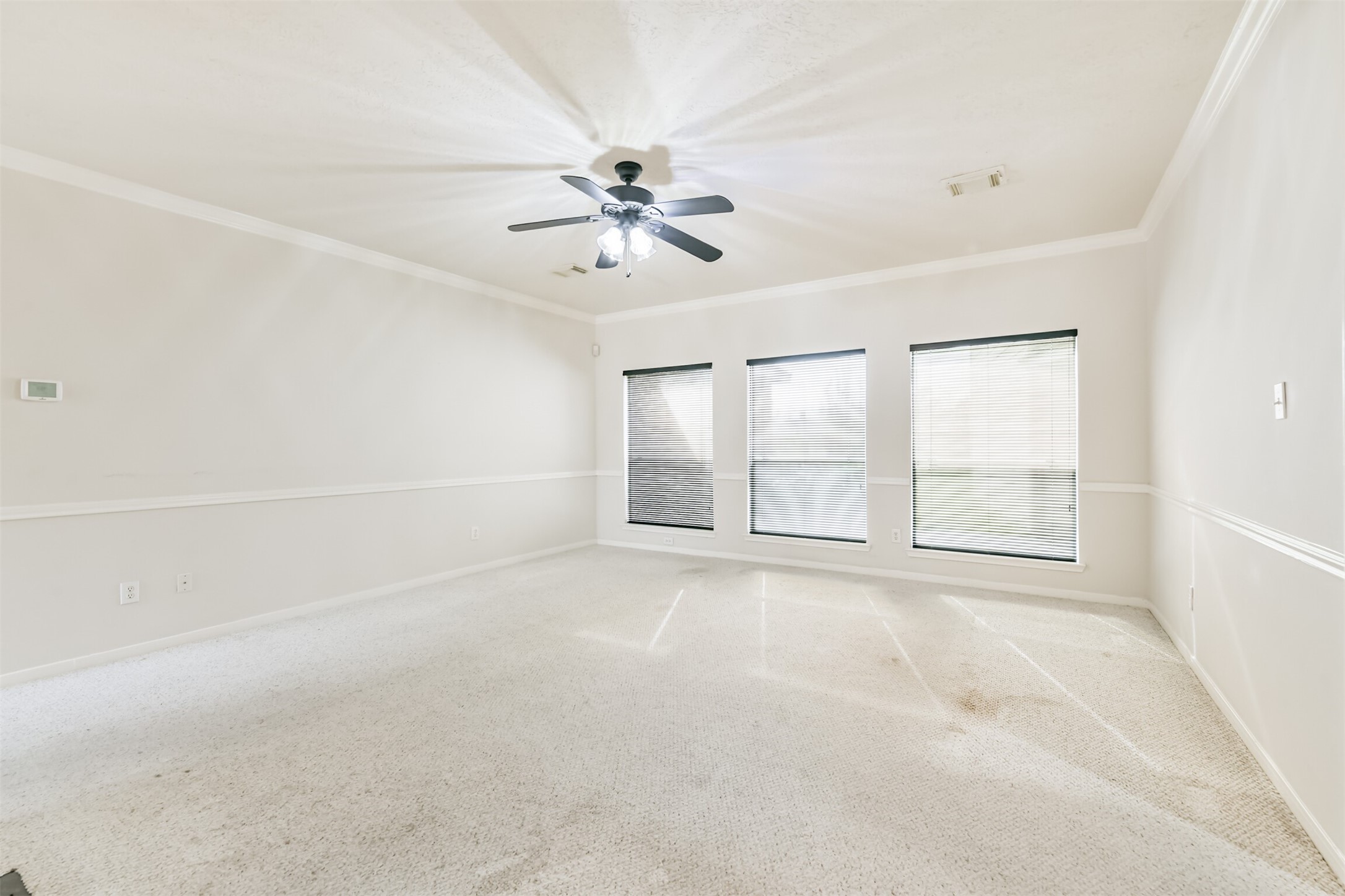 823 Hannock Glen Lane Spring, TX 77373 - Photo 15 of 48 an empty room with chandelier fan and windows