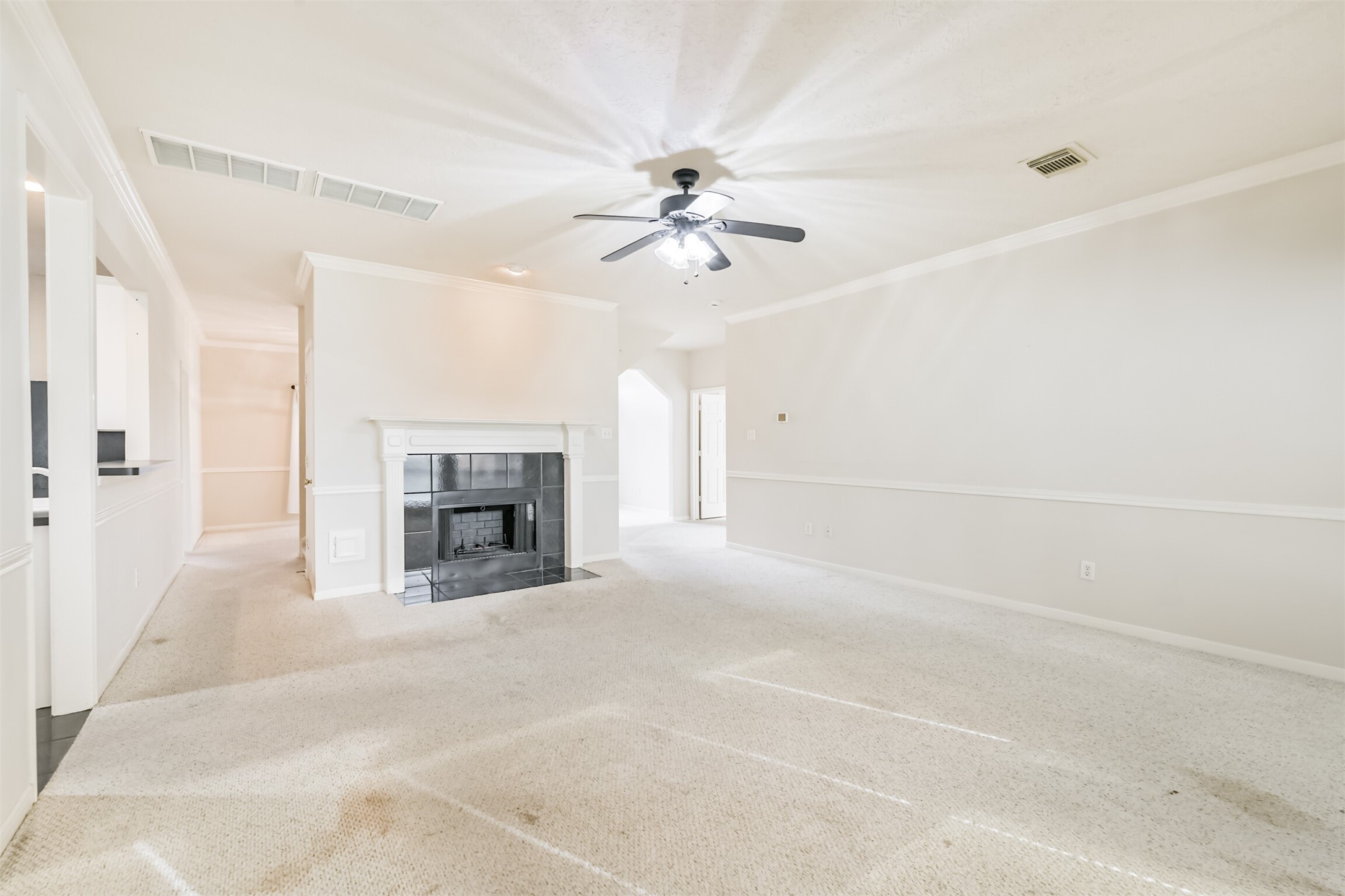 823 Hannock Glen Lane Spring, TX 77373 - Photo 16 of 48 a view of a livingroom with a fireplace and chandelier fan