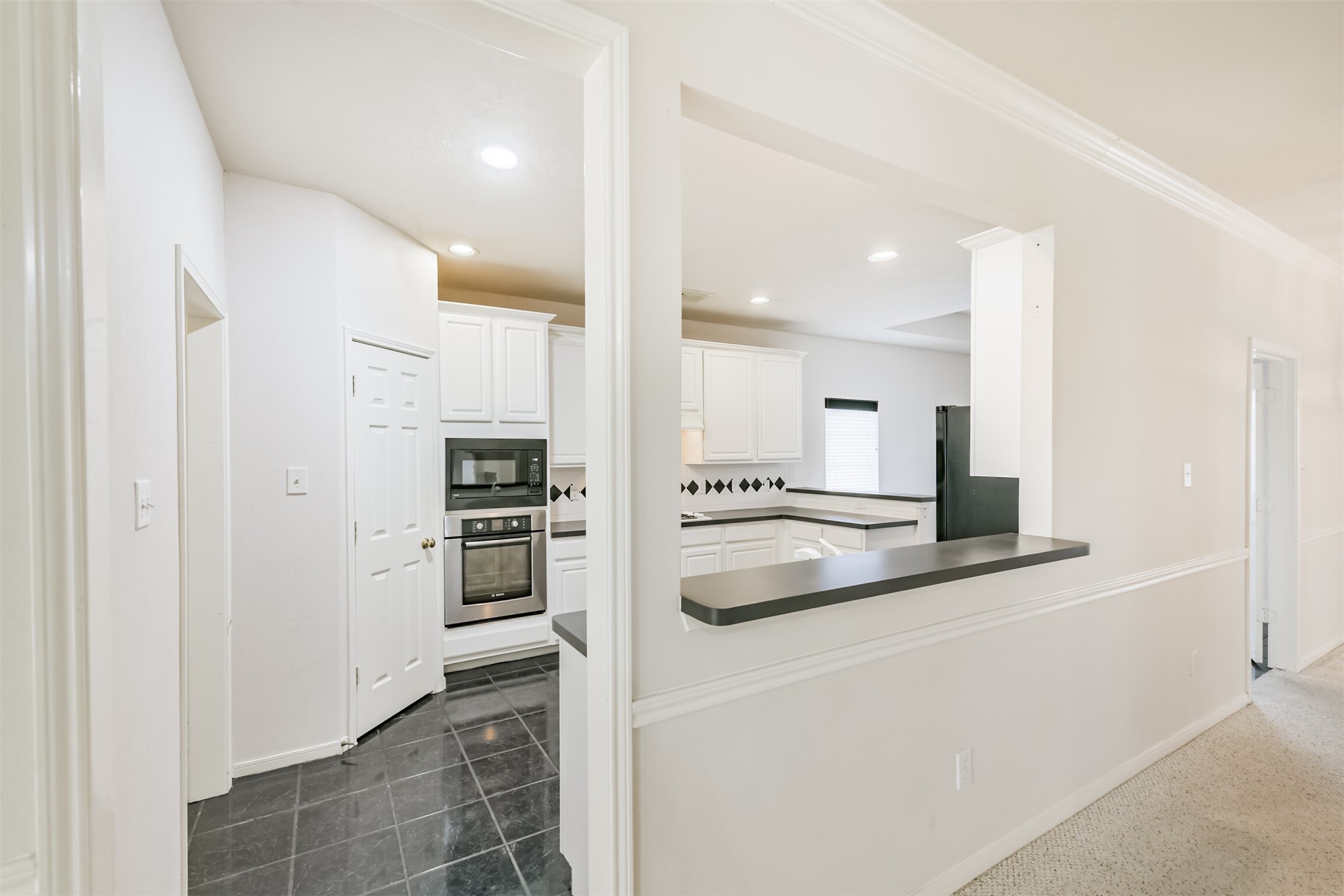 823 Hannock Glen Lane Spring, TX 77373 - Photo 18 of 48 a kitchen with stainless steel appliances granite countertop a refrigerator and a stove