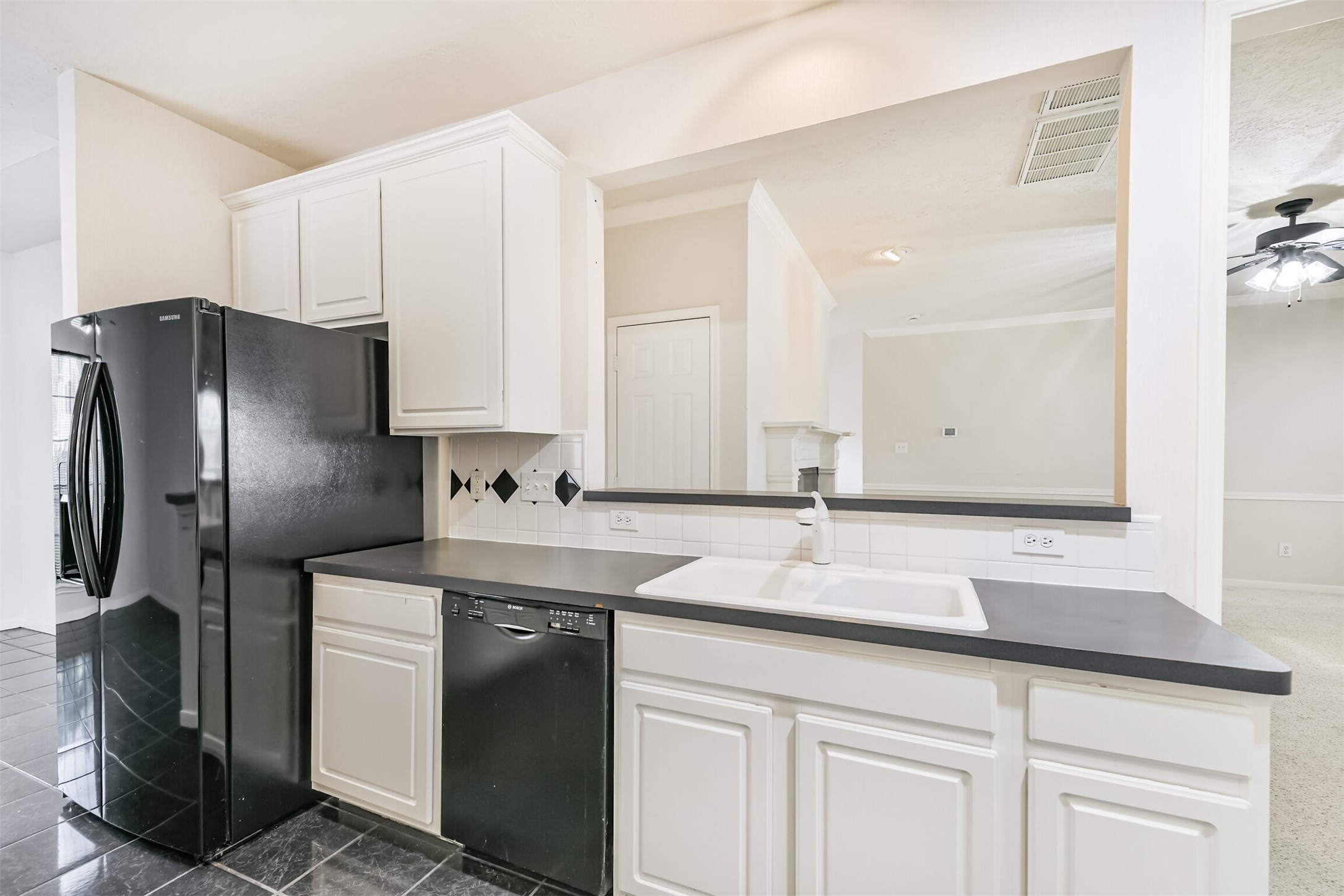 823 Hannock Glen Lane Spring, TX 77373 - Photo 23 of 48 a kitchen with stainless steel appliances granite countertop a sink and a refrigerator