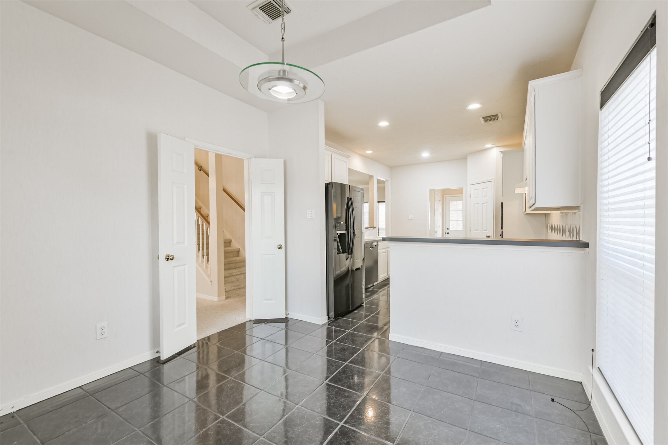 823 Hannock Glen Lane Spring, TX 77373 - Photo 25 of 48 a view of a kitchen with a refrigerator and a window