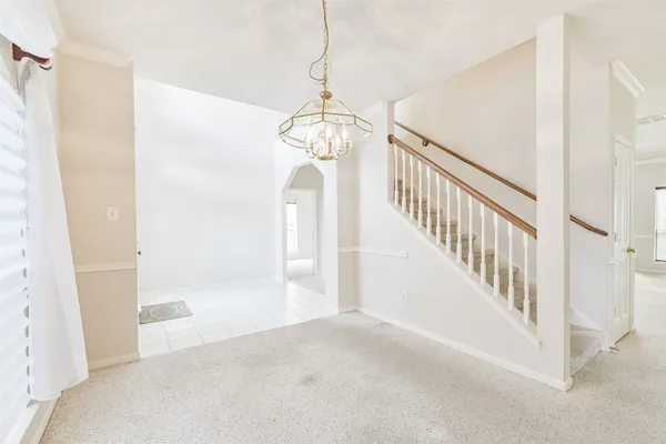 a view of a hallway view with staircase