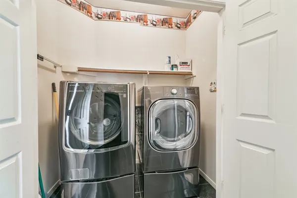 a utility room with dryer and washer