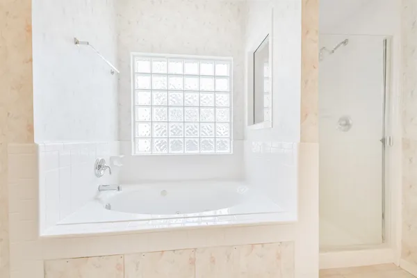 a white bath tub sitting next to a window