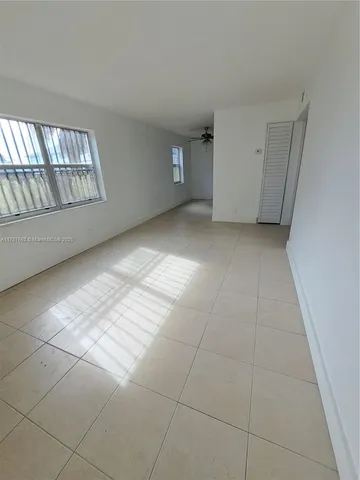 a view of an empty room and window