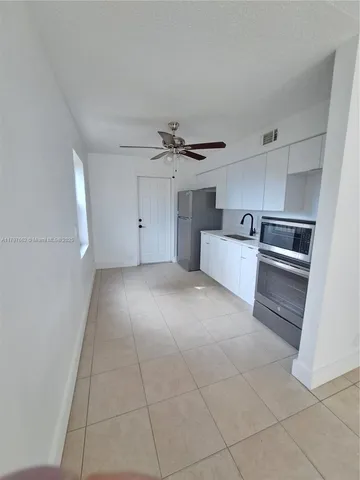 a view of a kitchen with a sink